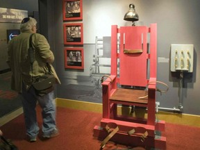 A mock-up of an electric chair is displayed during a media preview tour of The Mob Museum in Las Vegas, Nevada February 13, 2012. REUTERS/Steve Marcus