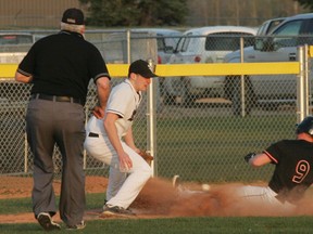 The relay throw to third base came in too late to catch the St. Albert Tigers runner as he slides in safely with a run-scoring triple. The Sox held two different leads in the game but couldn’t hold on in the end as the Tigers posted a 7-4 win in the season opening game for both teams. The Sox are back in action at Henry Singer Field in the Grove tonight (May 23) when they host the Edmonton Cubs in a 6:45 p.m. start. - Gord Montgomery, Reporter/Examiner