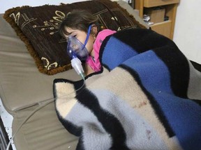 A girl, affected by what activists say was a gas attack, receives treatment inside a makeshift hospital in Kfar Zeita village in the central province of Hama May 22, 2014.

REUTERS/Badi Khlif