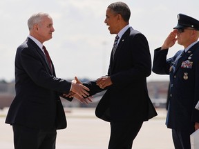 U.S. President Barack Obama is greeted by Minnesota Governor Mark Dayton upon his arrival in Minneapolis, June 1, 2012. Obama is in Minnesota to urge Congress to pass legislation creating a Veterans Jobs Corps.  REUTERS/Jason Reed  (UNITED STATES - Tags: POLITICS)