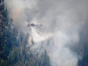 A water-dropping helicopter makes its delivery at the Slide Fire in Oak Tree Canyon near Sedona, Arizona.

REUTERS/U.S. Forest Service/Handout via Reuters
