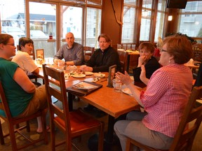 Alberta Party Leader Greg Clark (centre - furthest from camera) discusses provincial issues during a meet and greet in Stony Plain on May 16. - April Hudson, Reporter/Examiner