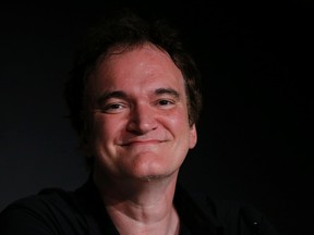 Director Quentin Tarantino attends a news conference during the 67th Cannes Film Festival in Cannes May 23, 2014. The film "Pulp Fiction" will be presented on Friday during a beach front cinema screening for its 20th anniversary.      REUTERS/Eric Gaillard