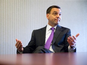 Ontario Progressive Conservative Leader Tim Hudak speaks with media at the Hilton London Friday. (CRAIG GLOVER, The London Free Press)