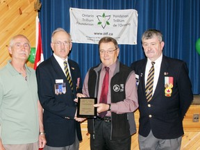 The Royal Canadian Legion branch in Clinton recently received a $15,000 grant from the Ontario Trillium Fund (OTF) to help purchase a new furnace. Pictured are Ray Chartrand, a member of the legion executive, legion president Rick Shropshall, OTF local representative Richard Smelski and legion first vice-president Pat Lafferty.  (Dave Flaherty/For the News Record)