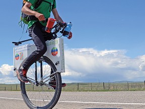 Joseph Boutilier, 24, is unicycling 5,000 kilometres across the country to raise awareness about climate change and other issues. John Stoesser photo/QMI Agency