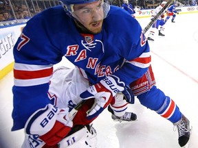 Rangers’ Ryan McDonagh roughs up the Canadiens’ Brendan Gallagher during Game 3. (AFP)