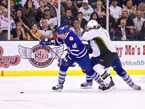 Marlies’ Sam Carrick holds off a Texas Stars player during Game 1 of the Western Conference final in Austin, Tex., last night. (Christian Sharpiro/Texas Stars)