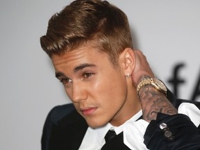 Justin Bieber arrives for amfAR's Cinema Against AIDS 2014 event in Antibes during the 67th Cannes Film Festival May 22, 2014. REUTERS/Benoit Tessier