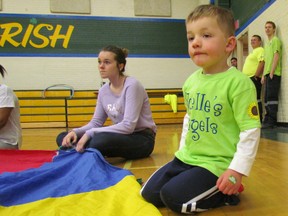Benjamin Knowles, 5, listens to the instructions before the start of a parachute game in the gym at St. Patrick's High School in Sarnia during one of several fundraising events held Saturday for the charity Noelle's Gift. Last year's inaugural Noelle's Gift of Fitness events raised $85,000 and organizers were hoping to match that amount this year. PAUL MORDEN / THE OBSERVER / QMI AGENCY