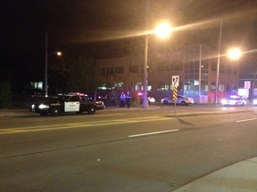 OPP and Ottawa police officers investigate a shooting on Hwy. 417 Friday evening. Cruisers were seen lined along Bronson Ave and Plymouth St. just after 11 p.m. MICHAEL SUTHERLAND-SHAW/Ottawa Sun