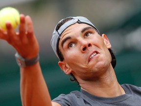 Rafael Nadal practises during a training session for the French Open  at the Roland Garros stadium in Paris May 24, 2014. (REUTERS/Gonzalo Fuentes)
