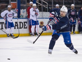 Alexei Emelin takes a shot during Canadiens practice at Madison Square Garden in New York on Saturday. (Ben Pelosse/. QMI Agency)