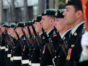 Soldiers stand at attention during the Freedom of the City Parade in Edmonton, Alberta on  Friday, May 23, 2014.  Perry Mah/ Edmonton Sun/ QMI Agency