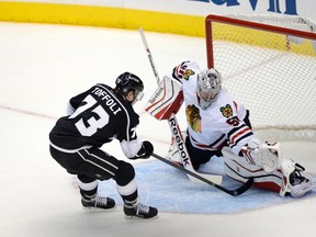Los Angeles Kings centre Tyler Toffoli scores on Chicago Blackhawks goalie Corey Crawford during Game 3 of the NHL Western Conference final Saturday at Staples Center. (Richard Mackson/USA TODAY Sports)