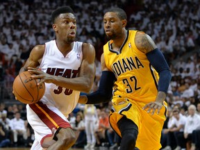 Miami Heat guard Norris Cole (30) drives to the basket against Indiana Pacers guard C.J. Watson in gGame 3 of the Eastern Conference Finals Saturday at American Airlines Arena. (Steve Mitchell/USA TODAY Sports)