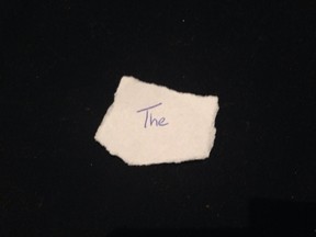 The word "the"  written on a scrap of paper. (EBay/HO)