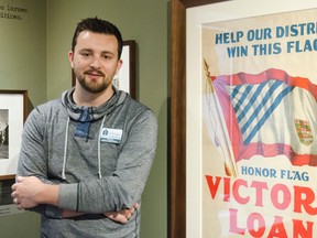The Bytown Museum exhibitions manager, Grant Vogl, stands with the Victory Bonds poster on display for the public on the second floor of the museum on Friday, May 23, 2014.    
Lacy Gillott/Ottawa Sun/QMI Agency