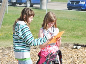 Whitecourt Central School Grade 5 students Samantha Stewart (l) and Madison Martell (r) go over their questionnaire during a scavenger hunt style tour of Percy Baxter School.
Barry Kerton | Whitecourt Star