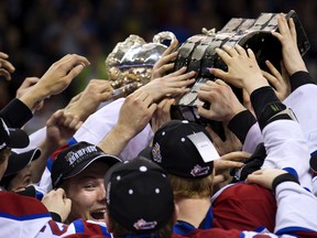 Edmonton Oil Kings players celebrate with the Memorial Cup in London, Ont., Sunday. (Derek Ruttan)