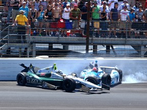 Ed Carpenter (left) and James Hinchcliffe crash in Turn 1 on Sunday at the Indy 500. (USA TODAY/PHOTO)