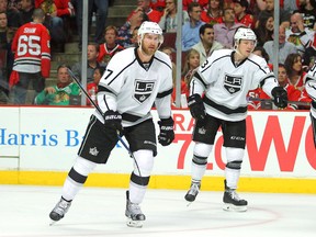 Kings linemates Jeff Carter (left) and Tyler Toffoli skate toward the bench after Carter scores a third-period goal in Game 3 against the Blackhawks. (Dennis Wierzbicki/USA TODAY Sports)