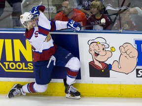 Edmonton Oil Kings forward Henrik Samuelsson celebrates a la Popeye after scoring his team's fifth goal during the Memorial Cup final in London, Ont. on Sunday, May 25, 2014. The Oil King's defeated the Guelph Storm 6-3. (Derek Ruttan/QMI Agency)