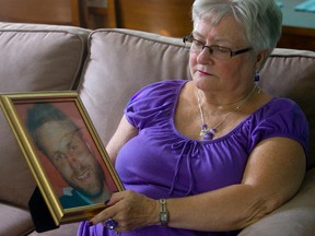 Jean Zak holds a photograph of her slain son, Jonathan.