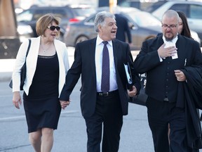 Mayor Joe Fontana is accompanied by his wife Vicky and legal counsel as he walks to the courthouse London, Ont. on Friday May 26, 2014. Fontana is on trial breach of trust, fraud under $5,000 and uttering forged documents. DEREK RUTTAN/ The London Free Press /QMI AGENCY