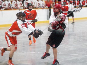 Wallaceburg Red Devils player Scott Pollard gets a shot off during a game at Wallaceburg Memorial Arena on Sunday against Point Edward. The Red Devils won 18-5.