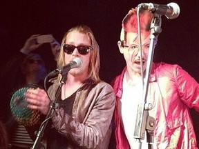 Macaulay Culkin, left, performs with The Pizza Underground bandmate. (@cheesedayz/Twitter photo)