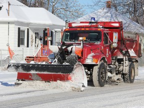 Senior city staff are proposing a new city department be created to manage Sarnia's 300-strong fleet of vehicles, including police cars, fire trucks, and snow plows — like the one in this file photo from Jan. 2013. A staff report is expected before council June 9. (Observer file photo)