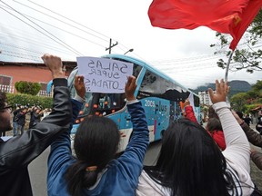 Teachers who demand better working conditions block the arrival of Brazilian national team football players, at the training center Granja Comary in Teresopolis in the hills north of Rio, Brazil, on May 26, 2014. (AFP PHOTO/VANDERLEI ALMEIDA)