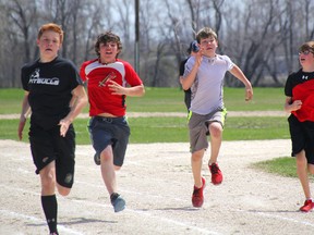 Some of the action at Yellowquill School's track and field day on Friday, May 23. (Johnna Ruocco/THE GRAPHIC/QMI AGENCY)