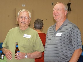 Don Bourne, left, and Bob O'Neil chat during the H&B reunion held on May 24 at the Moose Lodge. The plant closed five years ago, but a large number of staff met up to reunite and see old work colleagues.