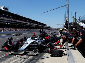 Kurt Busch pits during the 98th running of the Indianapolis 500.  Busch had a sixth-place finish in his first start in the Indy. (AFP)