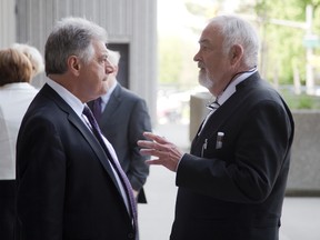 Mayor Joe Fontana speaks with his lawyer Gordon Cudmore during a recess in his trial at the courthouse London, Ont. on Friday May 26, 2014. Fontana is on trial breach of trust, fraud under $5,000 and uttering forged documents. DEREK RUTTAN/ The London Free Press /QMI AGENCY