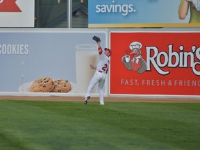 Donnie Webb runs down a fly ball during Monday's Goldeyes' home opener against Sioux City.