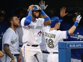 Jays' Jose Reyes celebrates Steve Tolleson's home run at the Rogers Centre in Toronto, Ont. on Monday May 26, 2014. (Craig Robertson/Toronto Sun/QMI Agency)