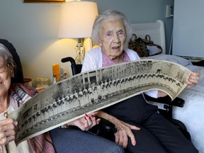 Vera Mumford, left, and Ruby Campbell, both alumni from the School of Nursing at Kingston General Hospital, show at a class photo featuring Mumford from 1934 at Trillium Ridge in Kingston. Ian MacAlpine The Whig-Standard