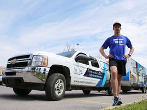 Sebastien Sasseville pauses in Kingston during Outrun Diabetes, a 7,500-kilometre cross-country run. ELLIOT FERGUSON/THE WHIG-STANDARD