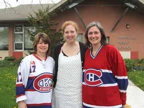 Marysville Public School secretary Lisa Posthumus, left, principal Jan Le Clair and teacher Tara Beers, dressed for a sports day, will be joining other staff, students and alumni in marking the Wolfe Island school's 60th anniversary in June. MICHAEL LEA\THE WHIG STANDARD