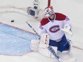 Canadiens goalie Dustin Tokarski allows the OT game-winner to the Rangers' Martin St. Louis in Game 4. (Ben Pelosse/QMI Agency)