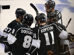 Los Angeles Kings defenceman Drew Doughty (8) celebrates with teammates including Anze Kopitar (11) after scoring a goal against the Chicago Blackhawks during the second period in game four of the Western Conference Final of the 2014 Stanley Cup Playoffs at Staples Center. (Richard Mackson-USA TODAY Sports)