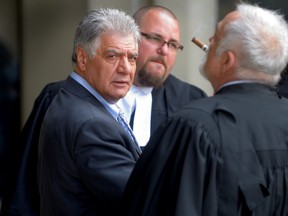 London Mayor Joe Fontana, left, takes a smoke break with his lawyer Gord Cudmore, left, during his trial at the London Courthouse on Tuesday May 27, 2014. (MORRIS LAMONT / QMI AGENCY)