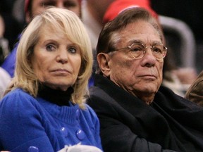 Los Angeles Clippers owner Donald Sterling (C), his wife Shelly (L) attend the NBA basketball game in this file photo. (REUTERS)
