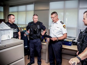 Left to right: Const. Jayson Sauve, left to right, Const. Jamie Graham, Chief Gilles Larochelle and  Const. Josh Conner. (Courtesy Kingston Police)