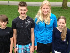 Ryan Harmer (left), Grade 7; Quaid Austin, Elisa Bolinger, both Grade 8; and Rylie Dietz, Grade 7 were top athletes in their respective grade divisions at the MDHS Grade 7 & 8 track and field meet May 16. ANDY BADER/MITCHELL ADVOCATE