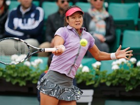 Li Na of China returns a forehand to Kristina Mladenovic of France during their match at the French Open in Paris on Tuesday, May 27, 2014. (Stephane Mahe/Reuters)