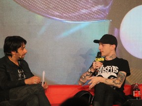 CBC Radio’s Jian Ghomeshi, left, interviews Canadian performer DeadMau5 during a keynote interview during Canadian Music Week in Toronto earlier this month. (Supplied photo)